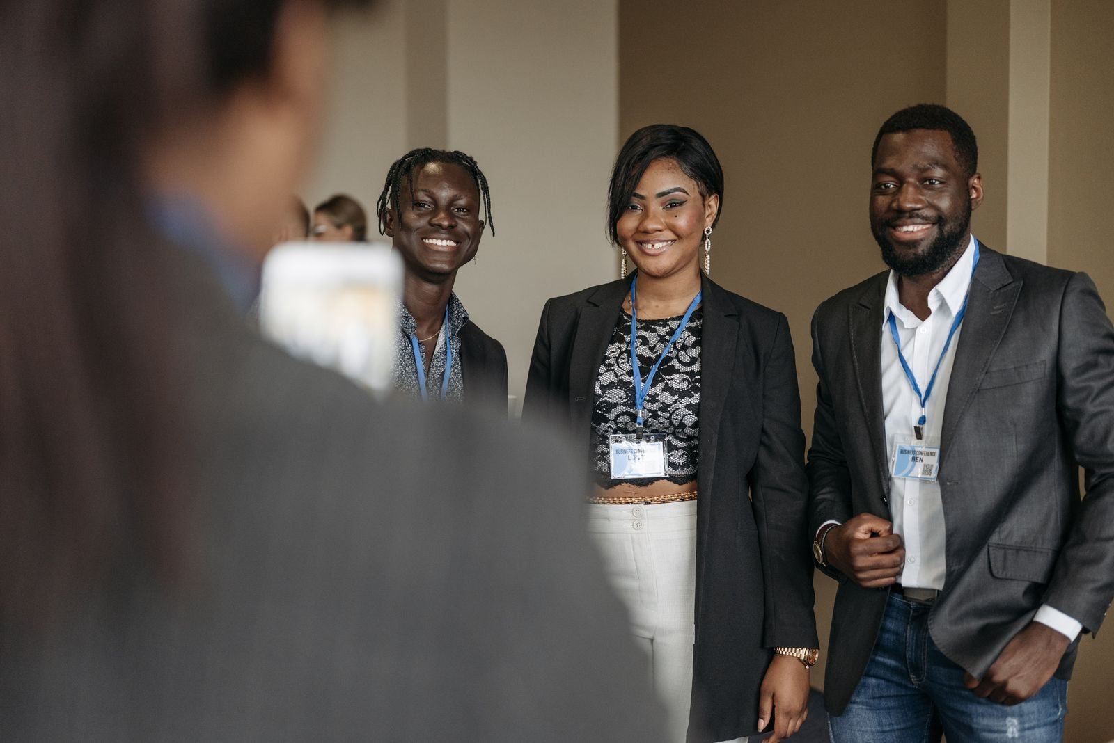 Corporate team members smiling together at a conference