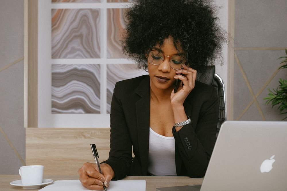 Entrepreneur on a phone call at her desk