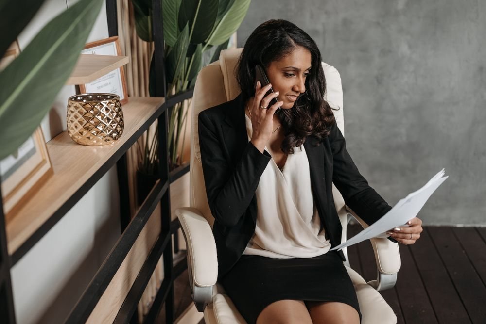 Business owner on a call reviewing documents