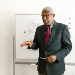 Senior advisor presenting at a whiteboard