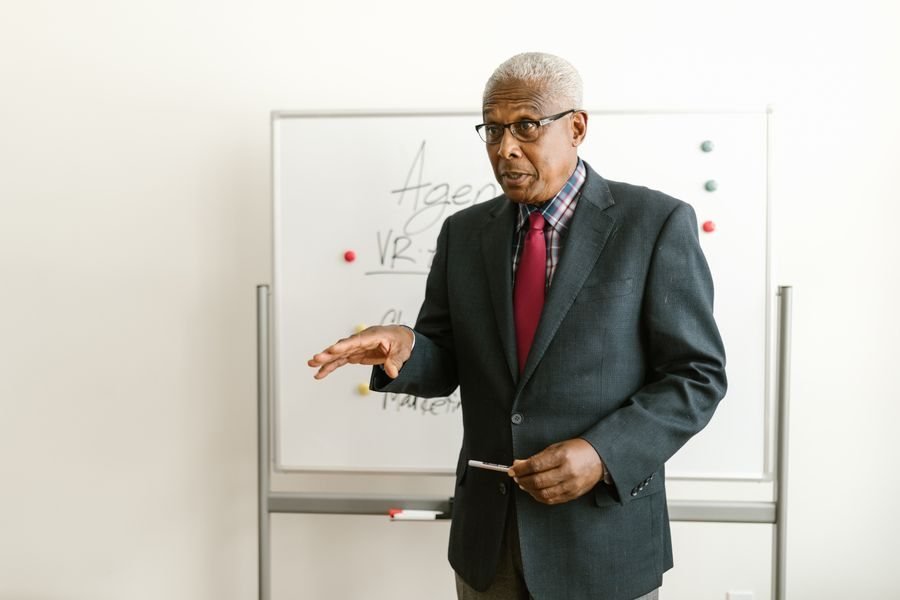 Senior advisor presenting at a whiteboard