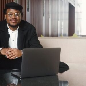 Consultant smiling at his laptop