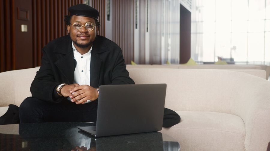 Consultant smiling at his laptop